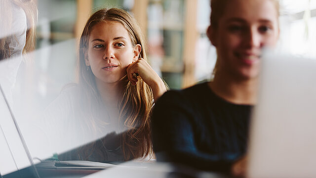 Young people studying in university classroom