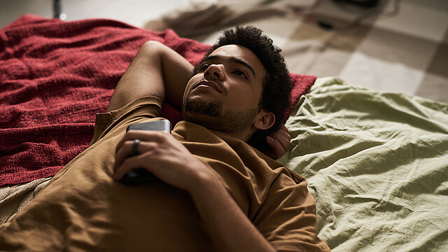 Guy staying alone with his thoughts